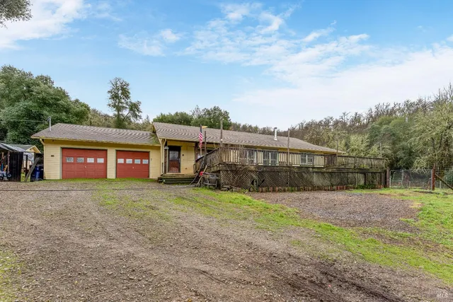 a view of balcony with wooden floor and fence