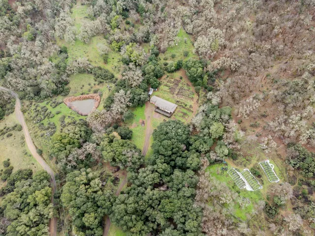 a view of a backyard with fence