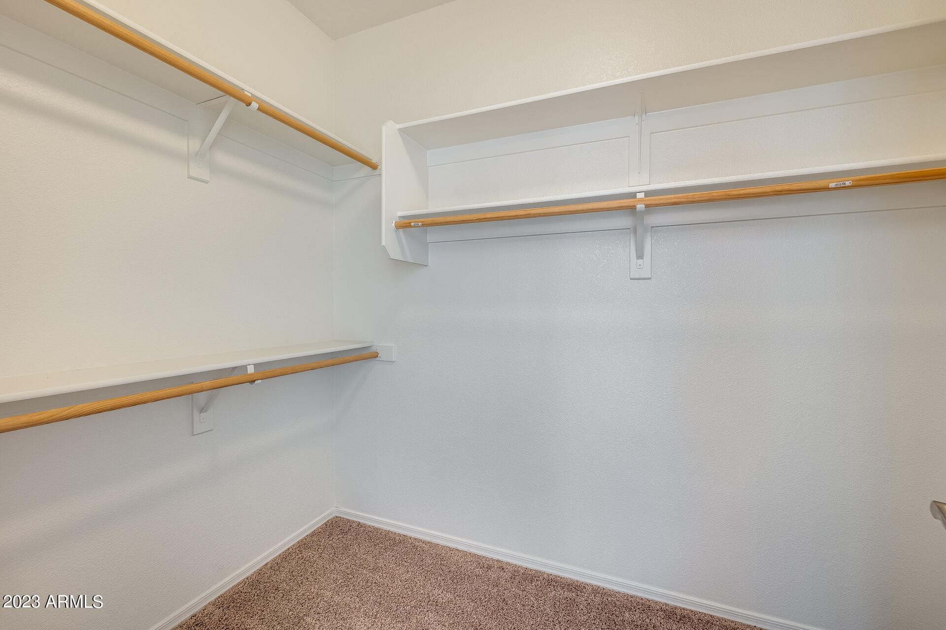 3244 West Maldonado Road Phoenix, AZ 85041 - Photo 35 of 43 a view of a room with racks on the wall