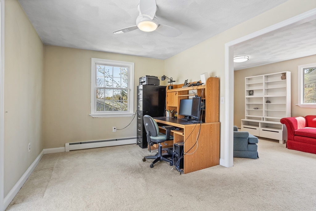 66 Old Stow Road Concord, MA 01742 - Photo 20 of 42 a view of a livingroom with workspace and a window