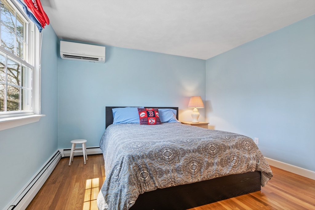 66 Old Stow Road Concord, MA 01742 - Photo 30 of 42 a bedroom with a bed and window