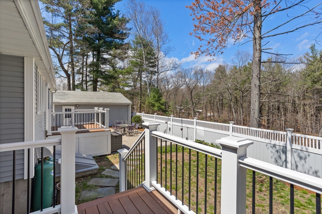 66 Old Stow Road Concord, MA 01742 - Photo 38 of 42 a view of house with a deck and furniture