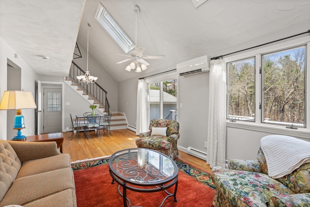 66 Old Stow Road Concord, MA 01742 - Photo 5 of 42 a living room with furniture and a large window