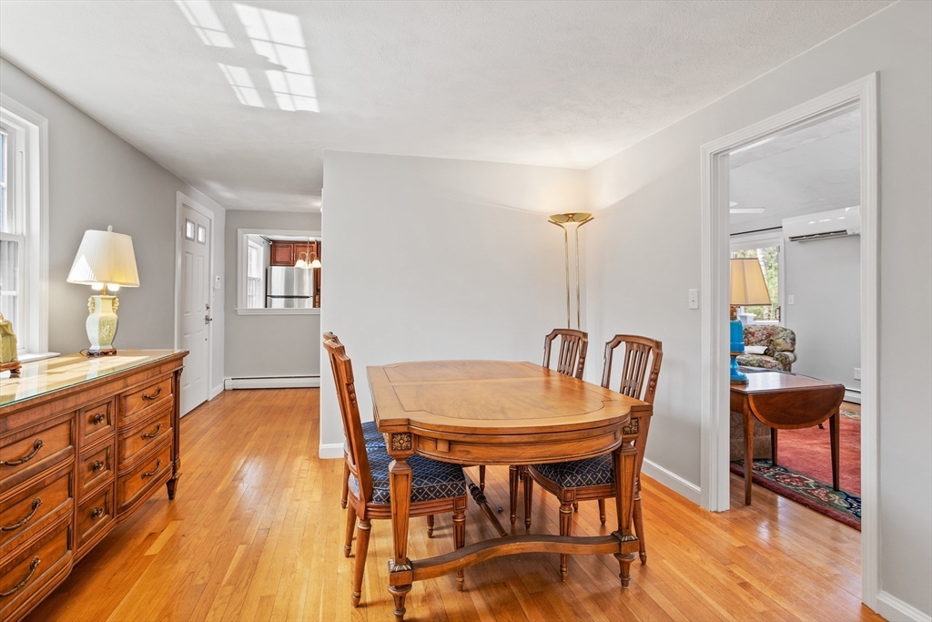66 Old Stow Road Concord, MA 01742 - Photo 8 of 42 a view of a dining room with furniture and wooden floor