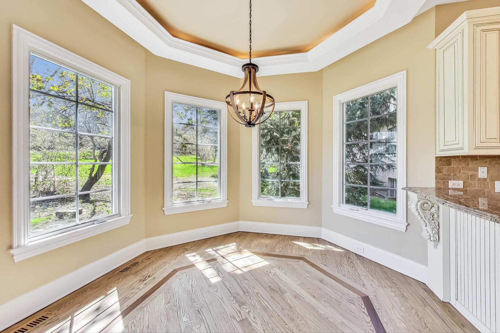 136 Fuller Road Hinsdale, IL 60521 - Photo 11 of 53 a view of a bedroom with windows