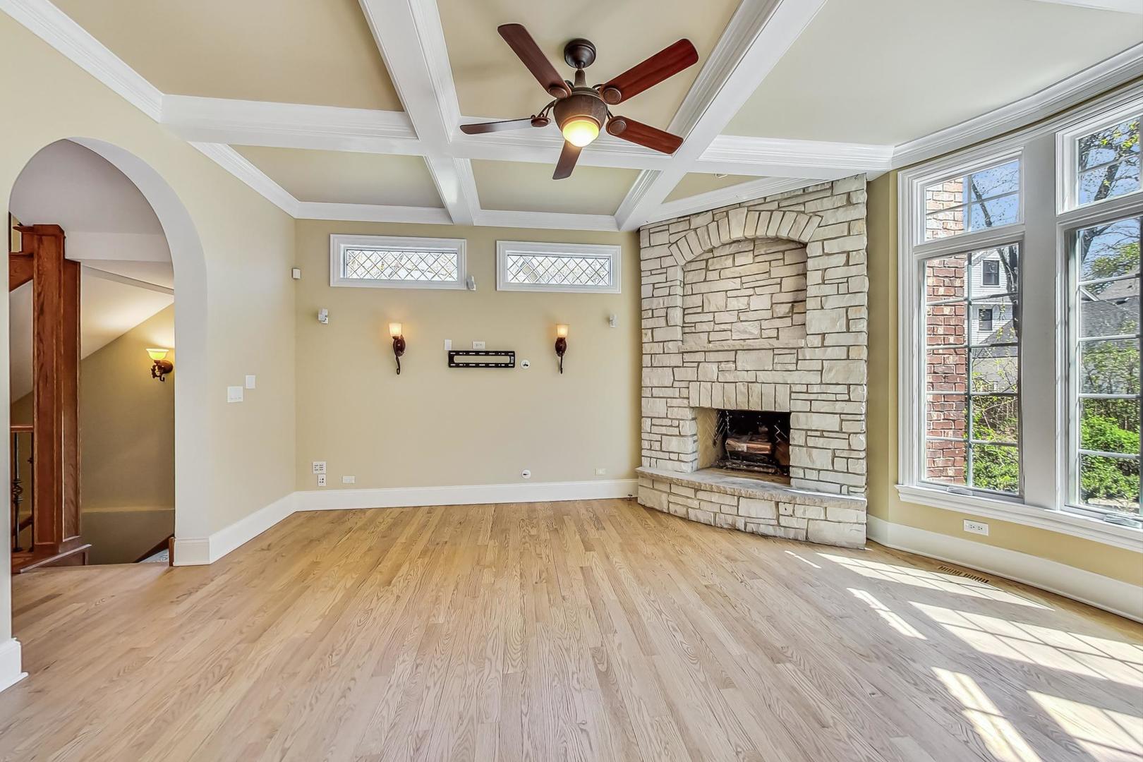 136 Fuller Road Hinsdale, IL 60521 - Photo 13 of 53 wooden floor in an empty room with a fireplace