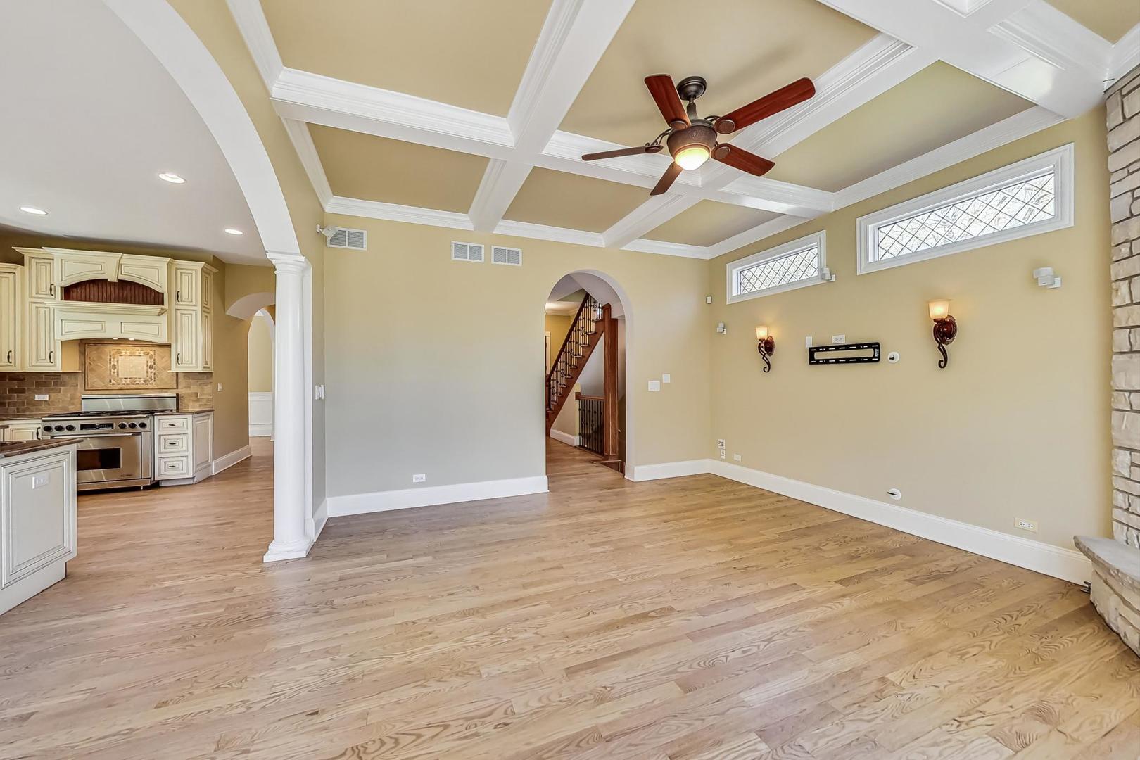 136 Fuller Road Hinsdale, IL 60521 - Photo 15 of 53 a view of a livingroom with a ceiling fan and wooden floor