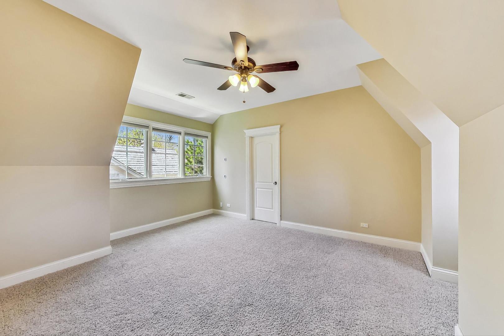 136 Fuller Road Hinsdale, IL 60521 - Photo 24 of 53 a view of an empty room with a window