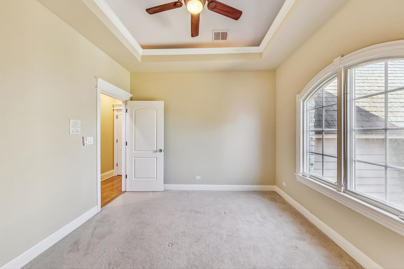 136 Fuller Road Hinsdale, IL 60521 - Photo 29 of 53 an empty room with windows and closet