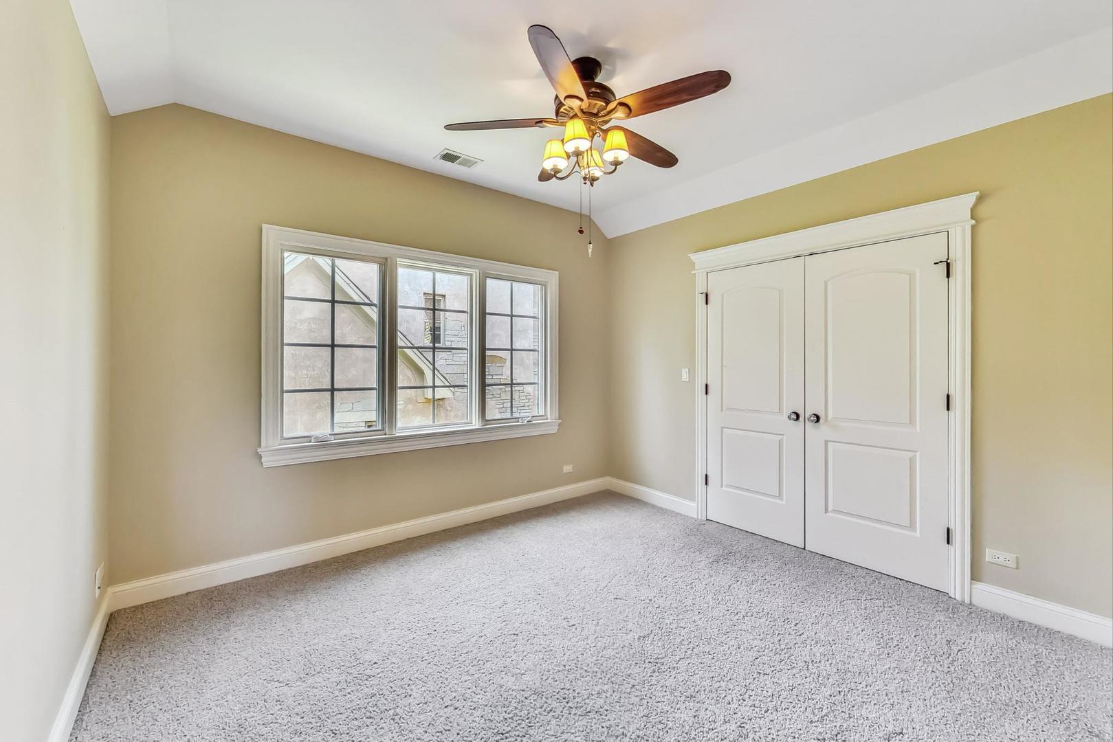 136 Fuller Road Hinsdale, IL 60521 - Photo 32 of 53 a view of an empty room with a window