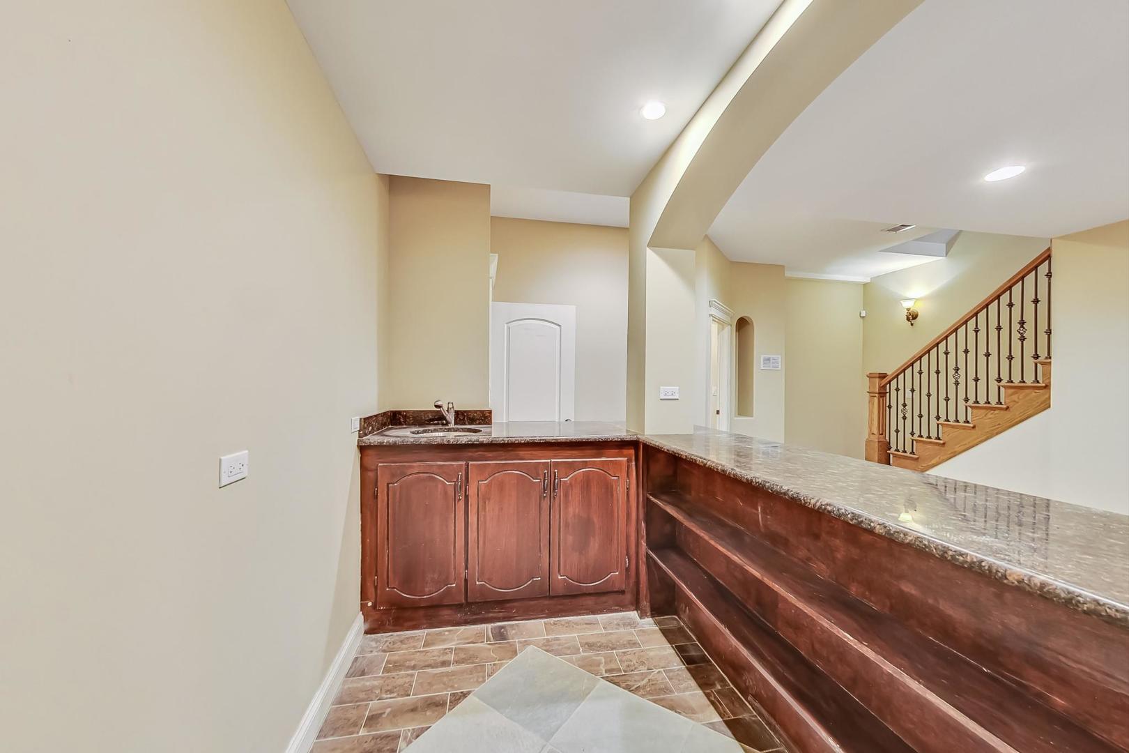 136 Fuller Road Hinsdale, IL 60521 - Photo 41 of 53 a spacious bathroom with a sink and a mirror