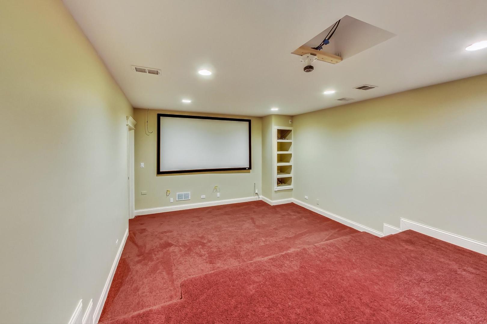 136 Fuller Road Hinsdale, IL 60521 - Photo 43 of 53 a view of a big room with wooden floor and windows