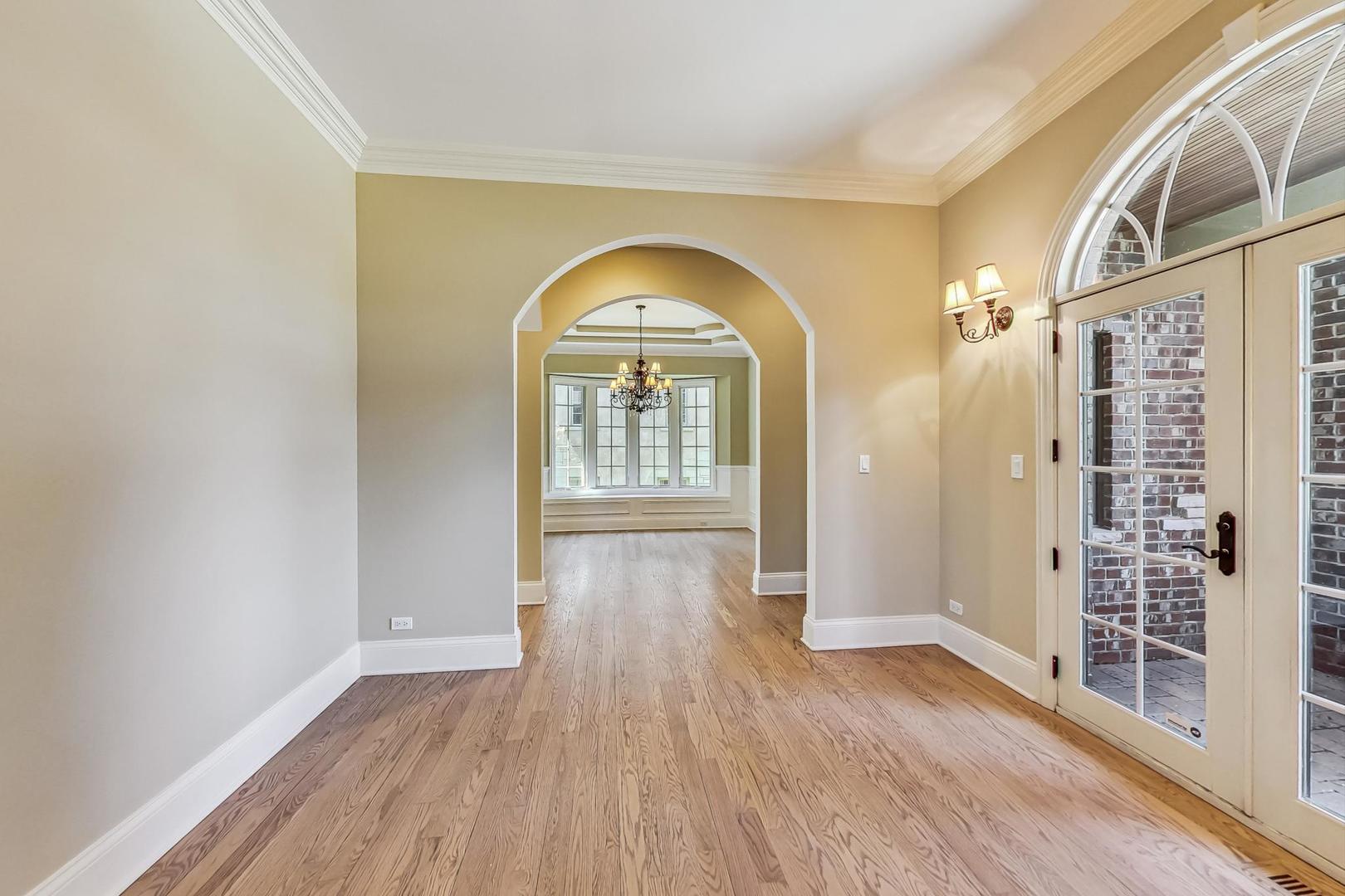 136 Fuller Road Hinsdale, IL 60521 - Photo 5 of 53 wooden floor in an empty room with a window