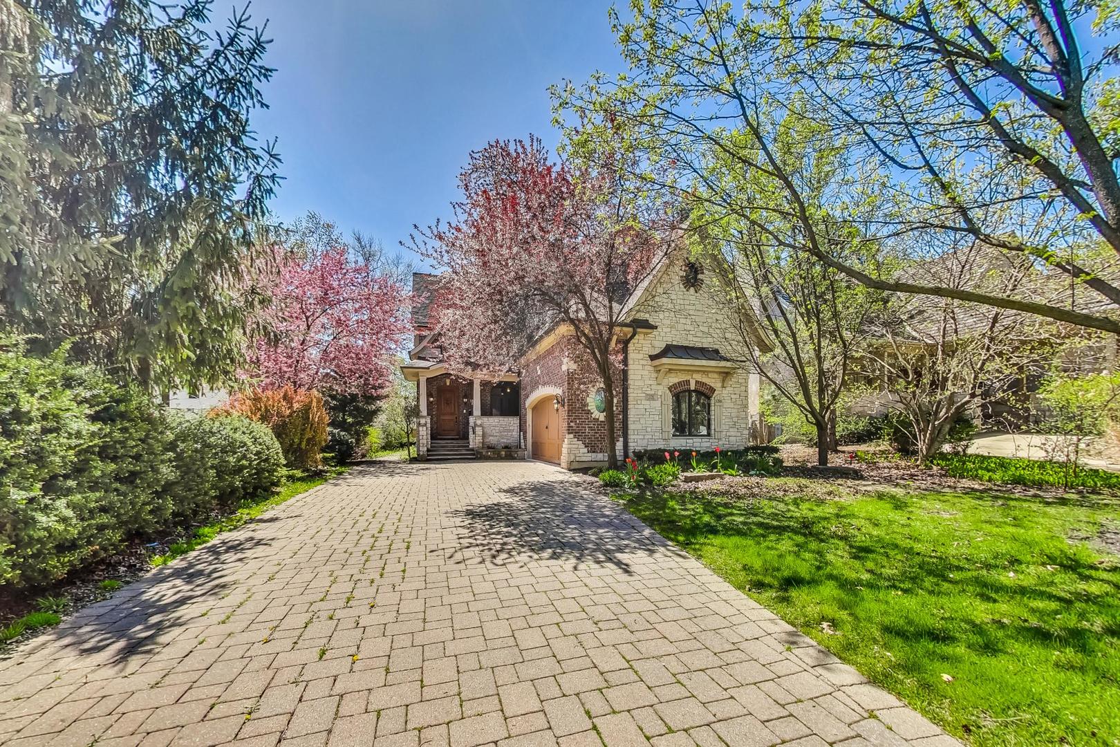 136 Fuller Road Hinsdale, IL 60521 - Photo 53 of 53 a front view of a house with a yard and trees