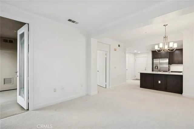 a view of a room with a cabinet and a mirror