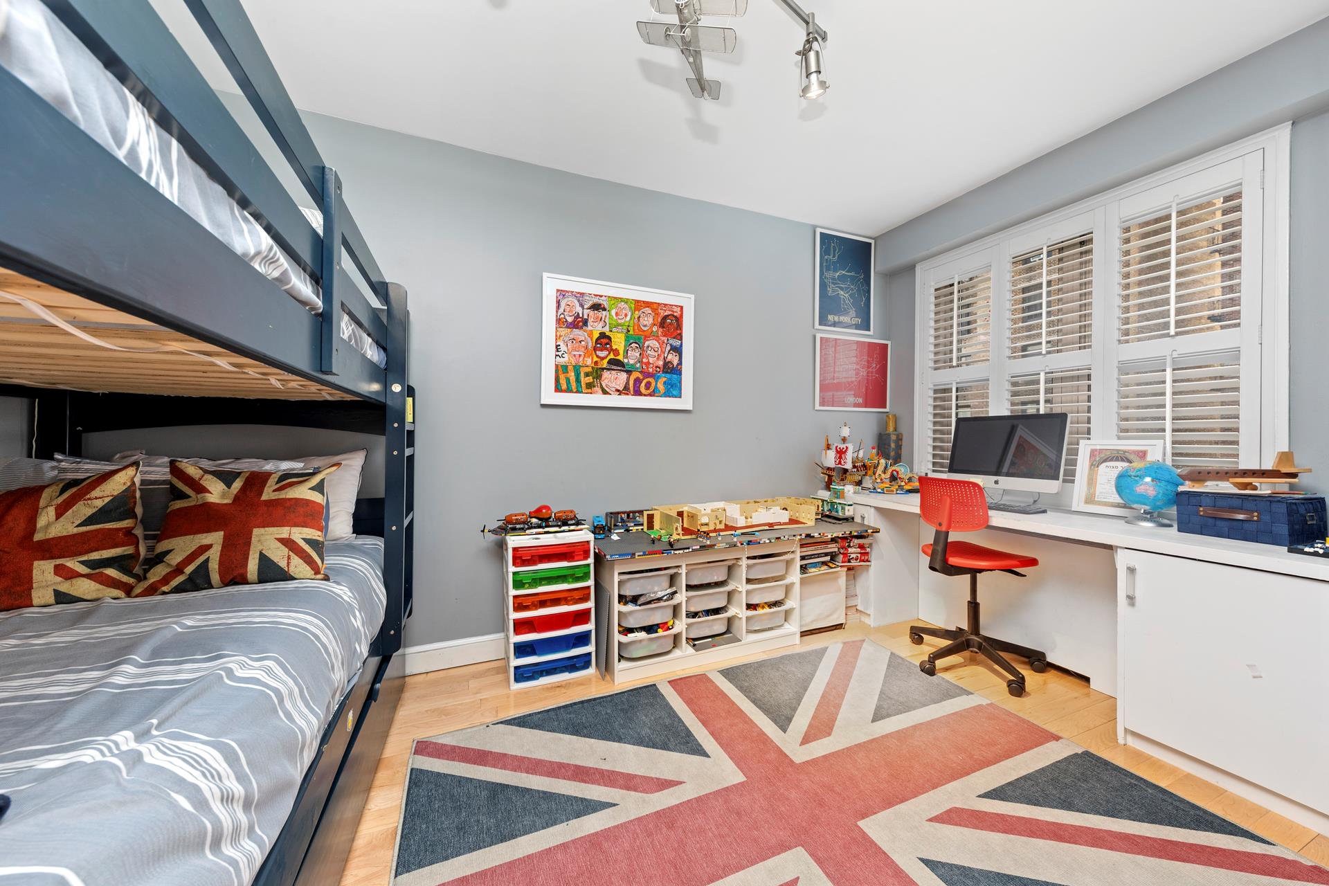 137 East 36th Street, Unit 5B Manhattan, NY 10016 - Photo 10 of 30 a bedroom with furniture and a book shelf