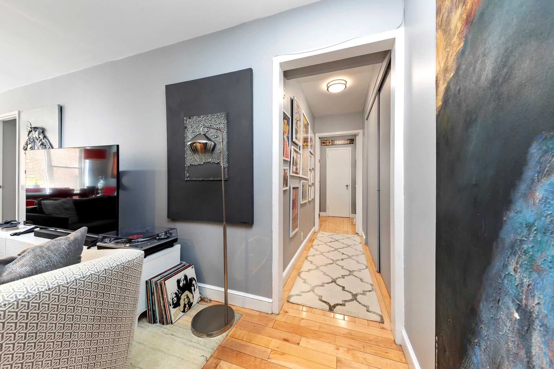137 East 36th Street, Unit 5B Manhattan, NY 10016 - Photo 13 of 30 a view of a hallway with workspace and mirror
