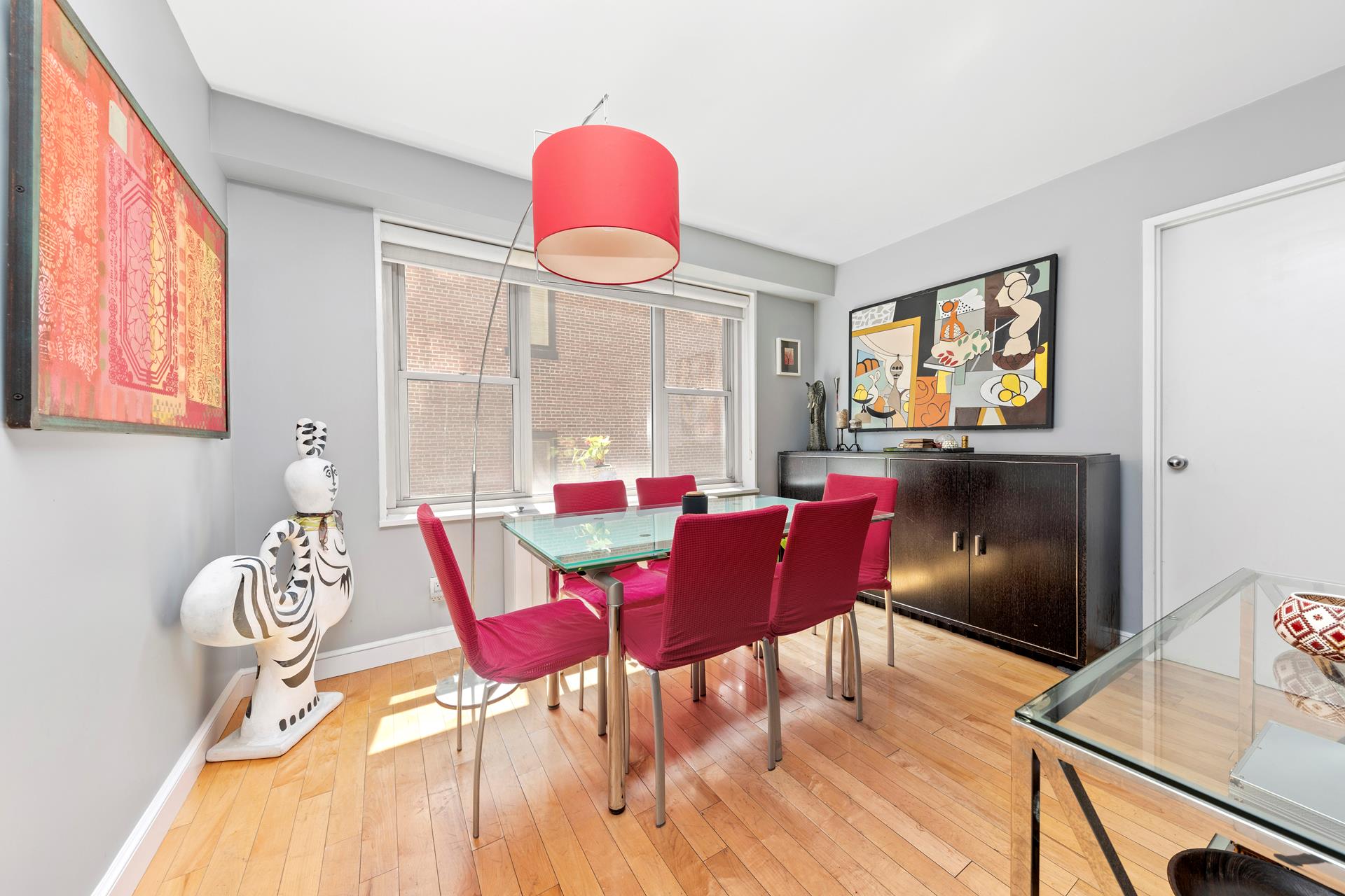 137 East 36th Street, Unit 5B Manhattan, NY 10016 - Photo 17 of 30 a view of a dining room with furniture window and wooden floor