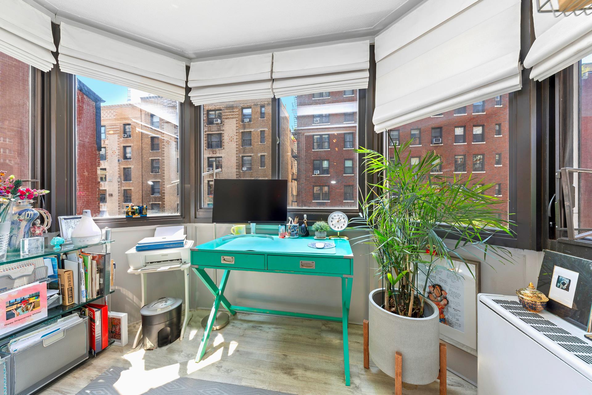 137 East 36th Street, Unit 5B Manhattan, NY 10016 - Photo 22 of 30 a room with furniture and a potted plant
