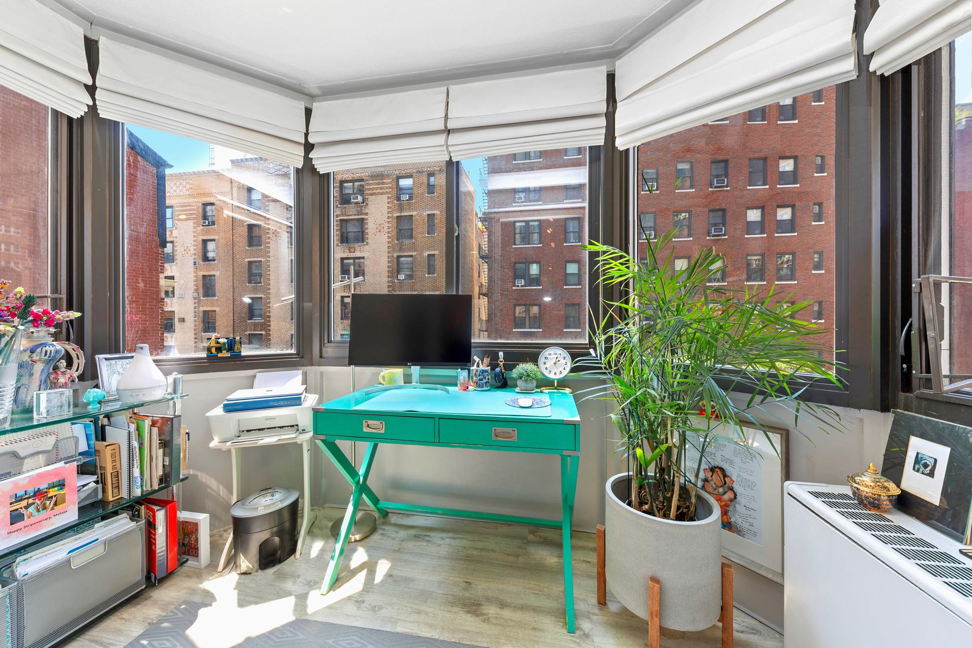 137 East 36th Street, Unit 5B Manhattan, NY 10016 - Photo 7 of 30 a room with furniture and a potted plant
