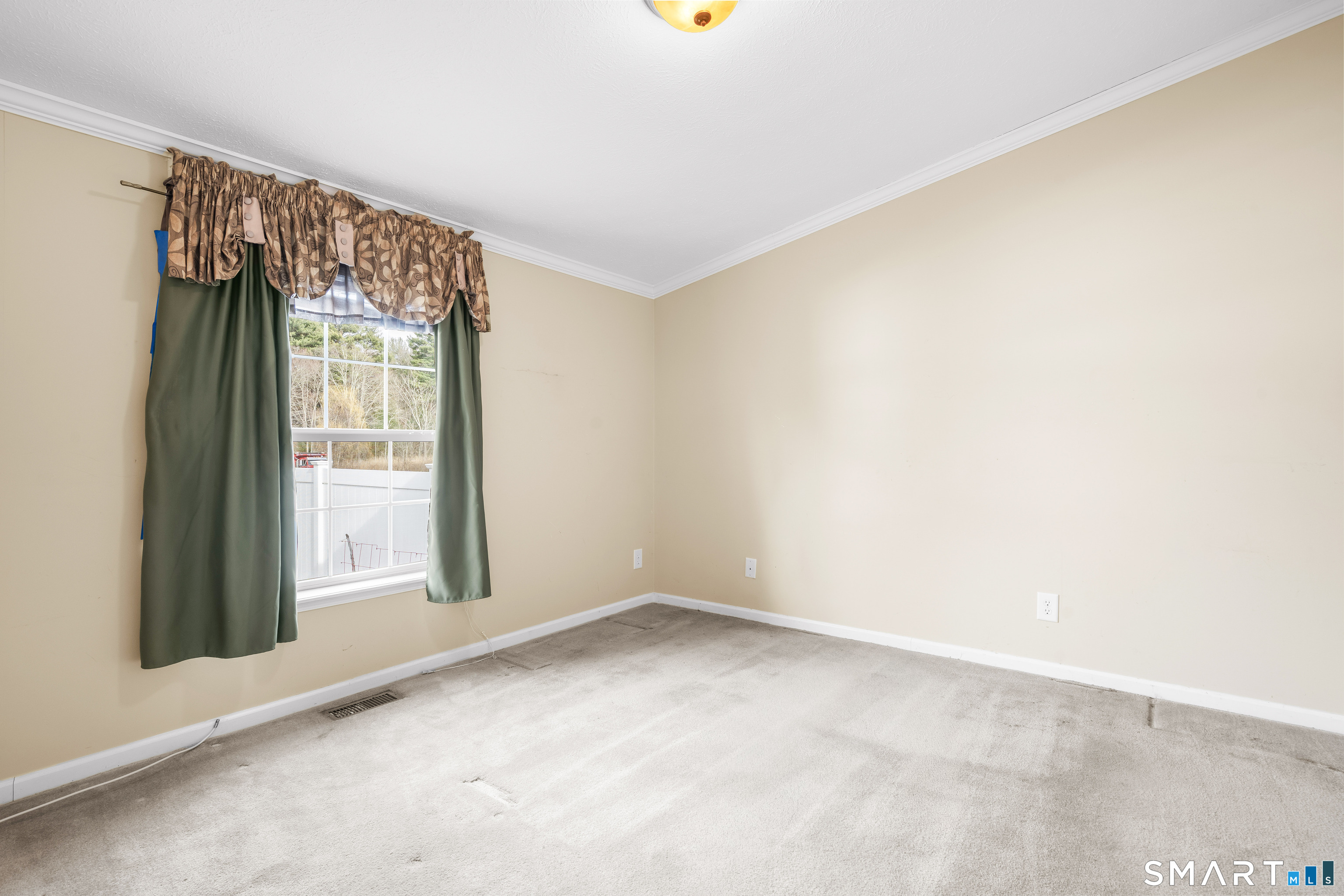 301 South Main Street Newtown, CT 06470 - Photo 14 of 23 a view of an empty room with a window