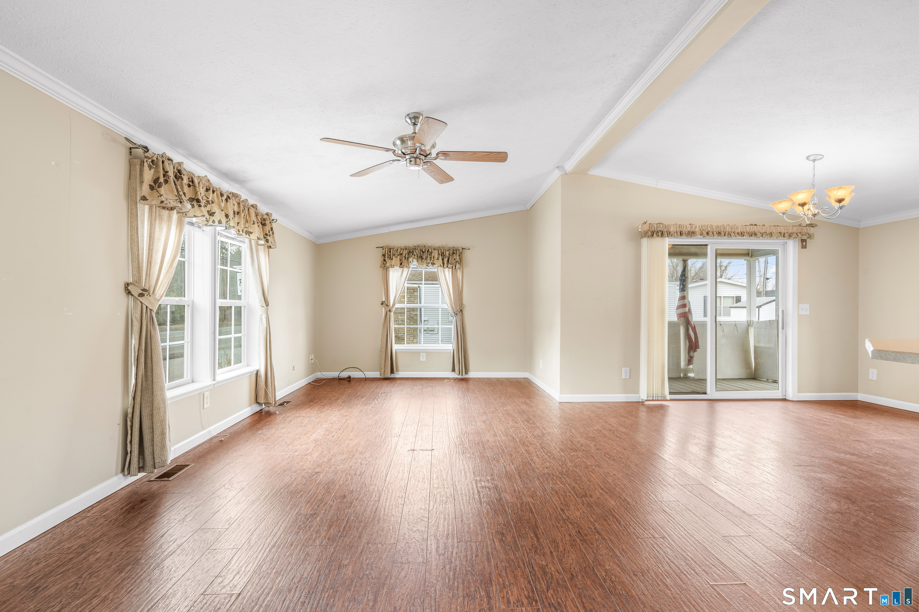 301 South Main Street Newtown, CT 06470 - Photo 8 of 23 a view of an empty room with wooden floor and a window