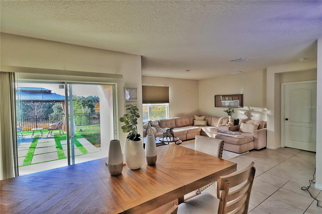 1724 Buckeye Road Davenport, FL 33837 - Photo 14 of 53 a living room with furniture and a large window