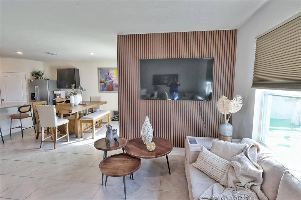 1724 Buckeye Road Davenport, FL 33837 - Photo 16 of 53 a living room with furniture a window and a table