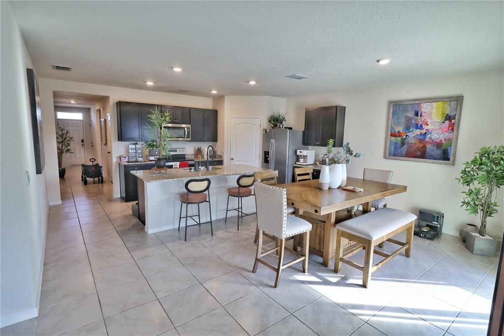 1724 Buckeye Road Davenport, FL 33837 - Photo 17 of 53 a view of a dining room with furniture