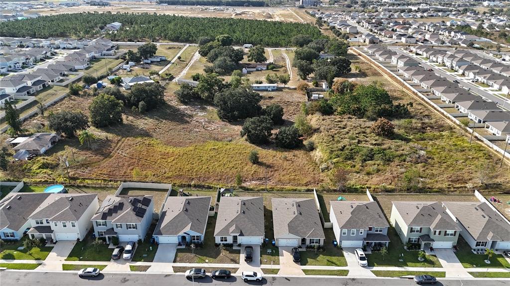 1724 Buckeye Road Davenport, FL 33837 - Photo 22 of 53 an aerial view of residential houses with outdoor space