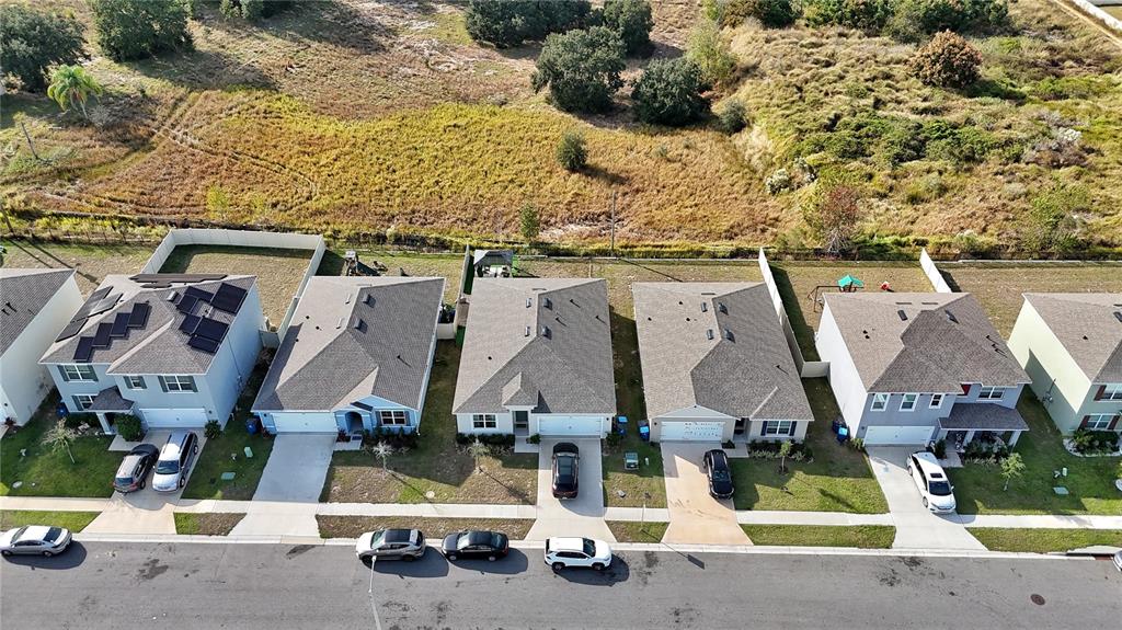1724 Buckeye Road Davenport, FL 33837 - Photo 28 of 53 an aerial view of residential houses with outdoor space