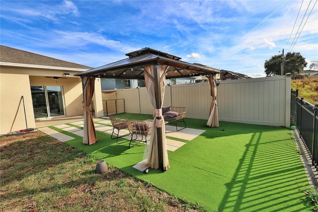 1724 Buckeye Road Davenport, FL 33837 - Photo 33 of 53 a front view of a house with garden