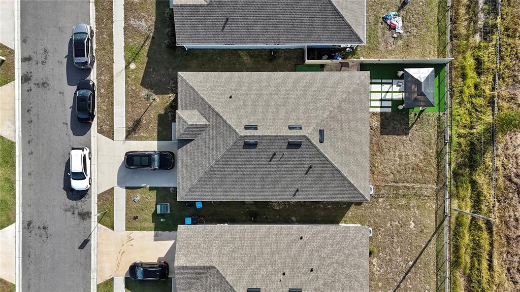 1724 Buckeye Road Davenport, FL 33837 - Photo 34 of 53 an aerial view of residential houses with outdoor space