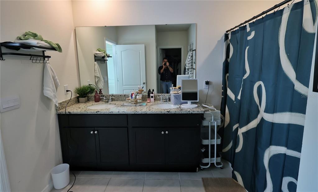 1724 Buckeye Road Davenport, FL 33837 - Photo 47 of 53 a bathroom with a sink vanity and mirror