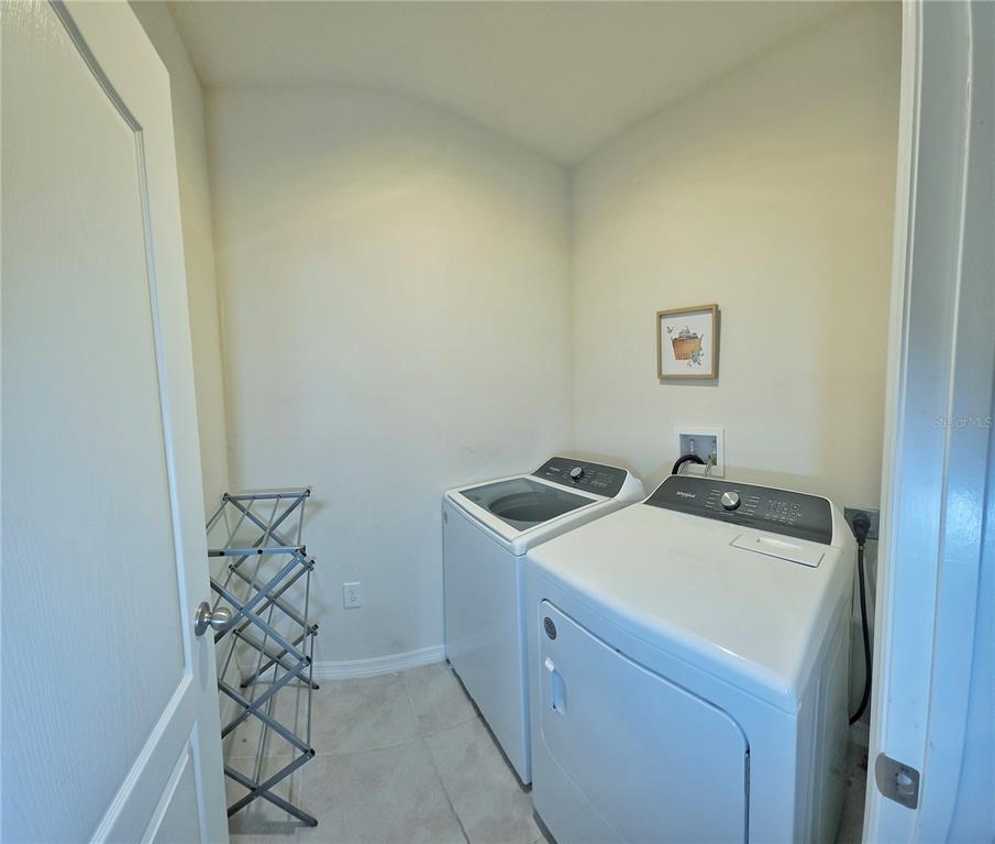 1724 Buckeye Road Davenport, FL 33837 - Photo 51 of 53 a utility room with dryer and washer