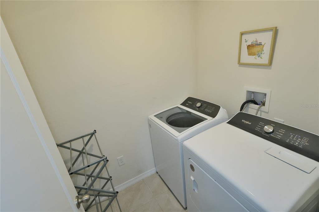 1724 Buckeye Road Davenport, FL 33837 - Photo 52 of 53 a utility room with dryer and washer