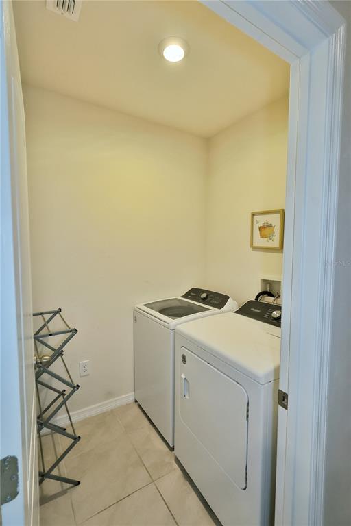 1724 Buckeye Road Davenport, FL 33837 - Photo 53 of 53 a utility room with dryer and washer