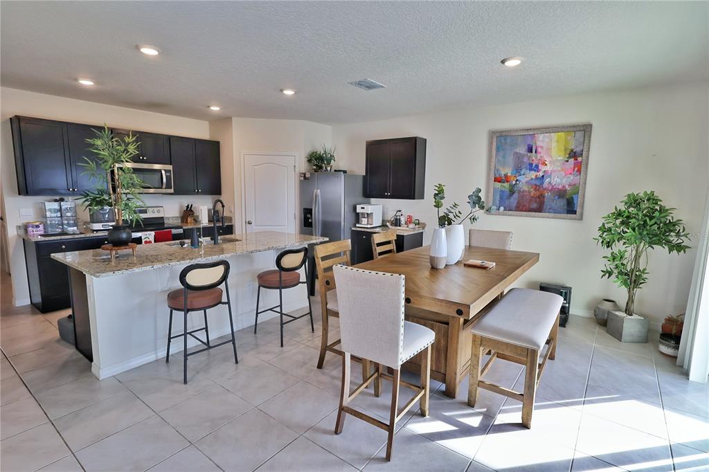 1724 Buckeye Road Davenport, FL 33837 - Photo 7 of 53 a view of a dining room with furniture