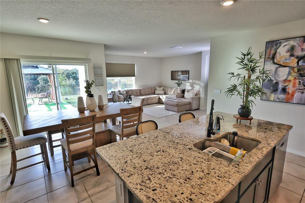 1724 Buckeye Road Davenport, FL 33837 - Photo 10 of 53 a living room with furniture and a large window