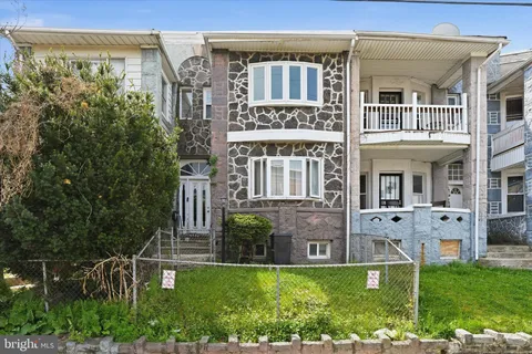 a view of a building with a yard