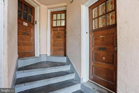 a view of front door with stairs