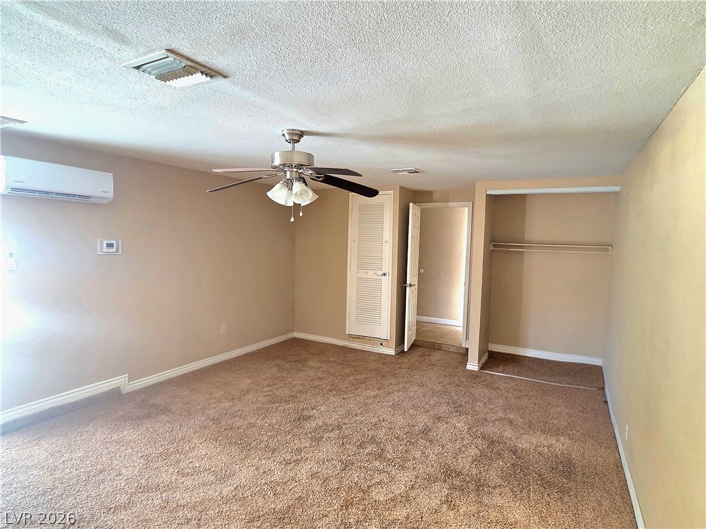 3648 Bronco Road Las Vegas, NV 89103 - Photo 10 of 24 Well-appointed sleeping quarters feature plush carpet flooring and a built-in closet for ample storage.