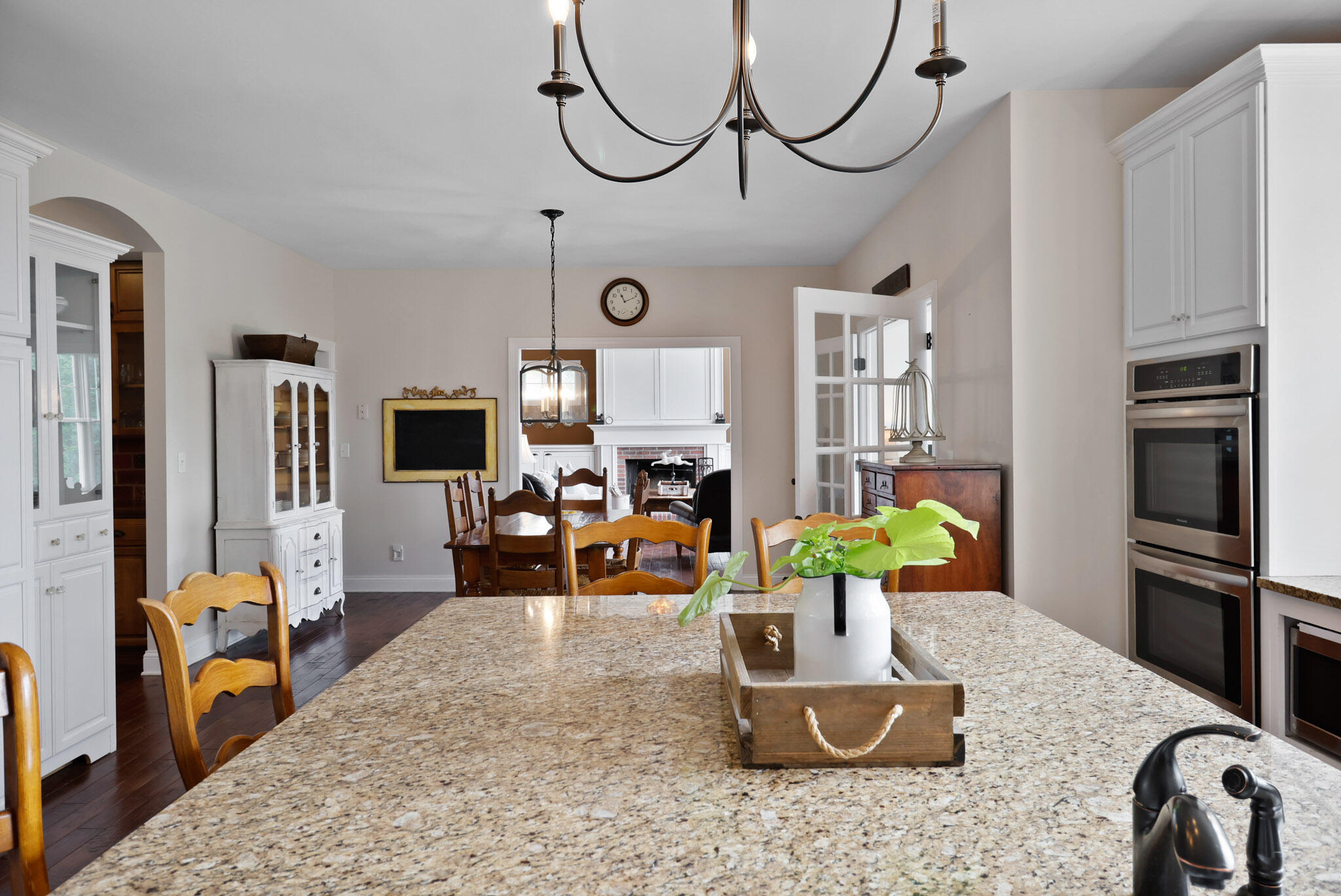 709 Pennock Circle Crown Point, IN 46307 - Photo 13 of 67 a living room with furniture a flat screen tv and a refrigerator