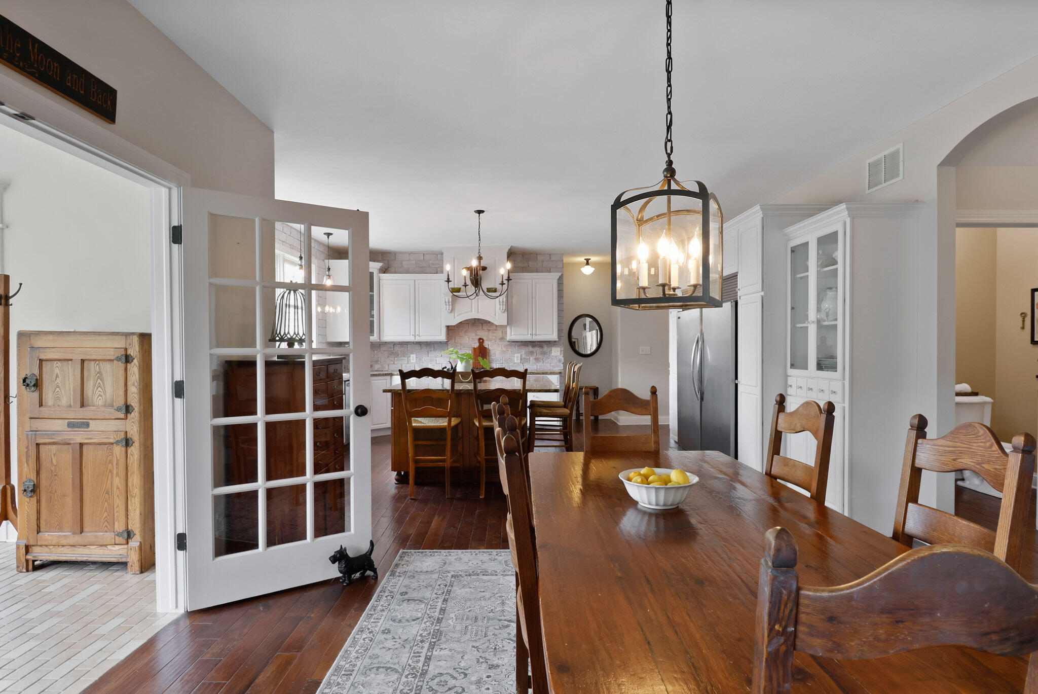 709 Pennock Circle Crown Point, IN 46307 - Photo 17 of 67 a view of a dining room with furniture window and wooden floor