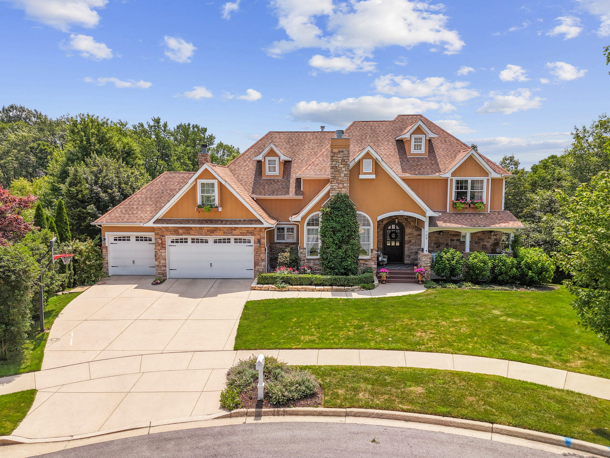 709 Pennock Circle Crown Point, IN 46307 - Photo 2 of 67 a front view of a house with a yard and garage