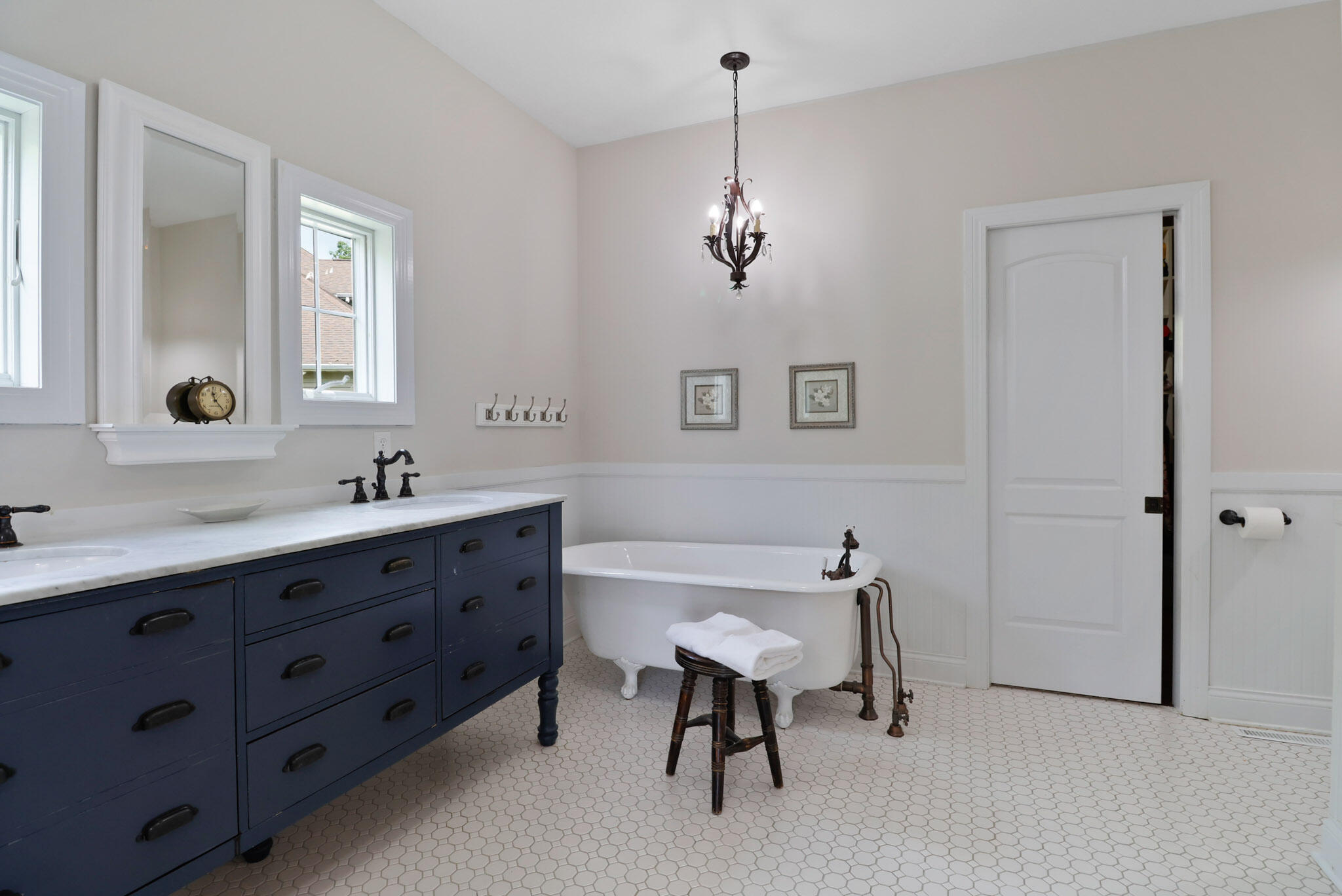 709 Pennock Circle Crown Point, IN 46307 - Photo 28 of 67 a spacious bathroom with a double vanity sink a mirror and a window