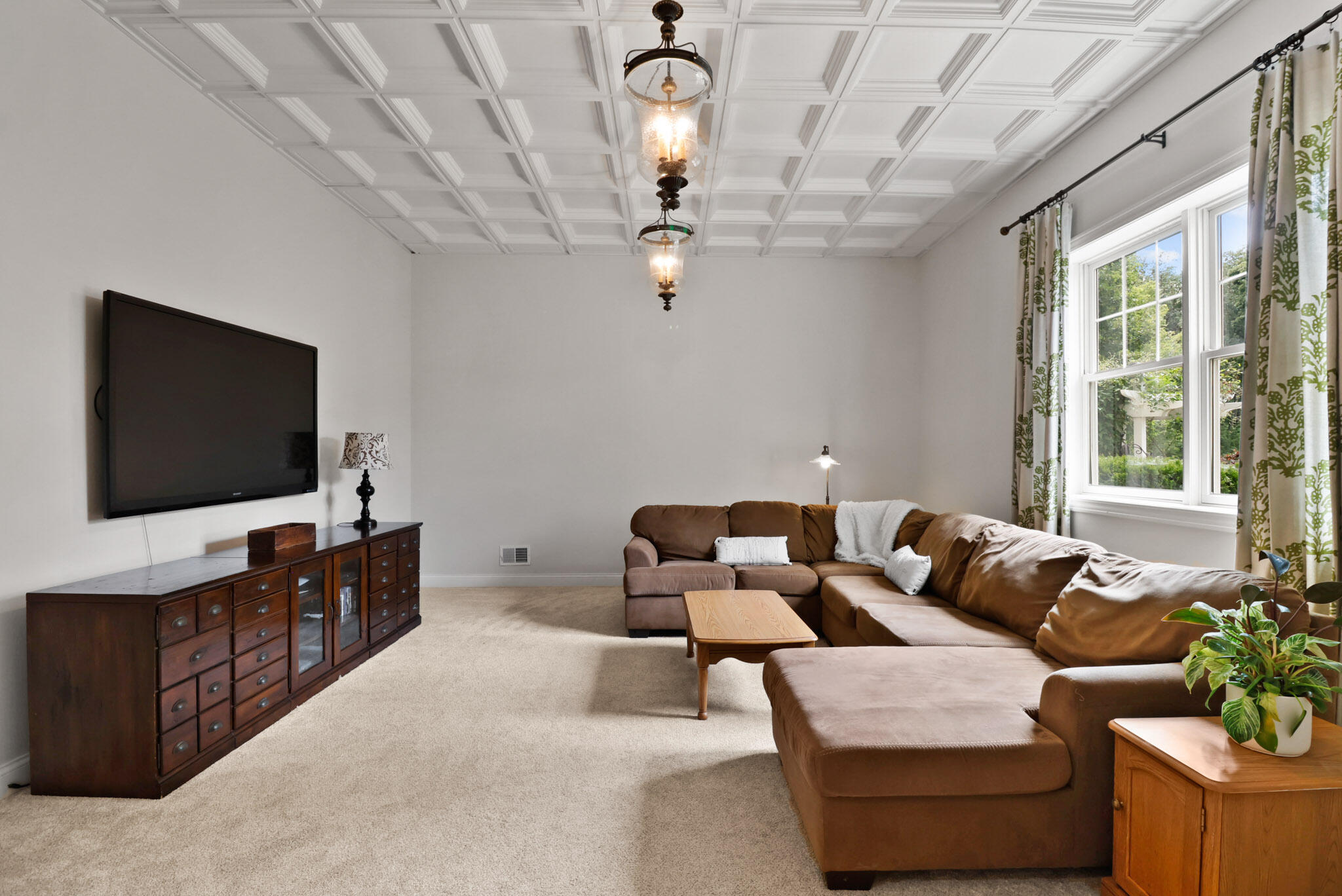 709 Pennock Circle Crown Point, IN 46307 - Photo 50 of 67 a living room with furniture and a flat screen tv