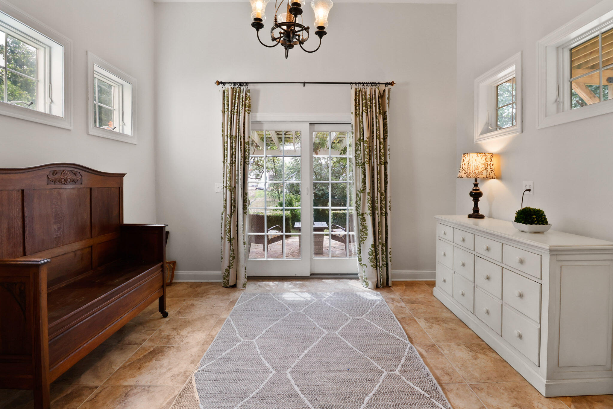 709 Pennock Circle Crown Point, IN 46307 - Photo 52 of 67 a living room with furniture a chandelier and a window