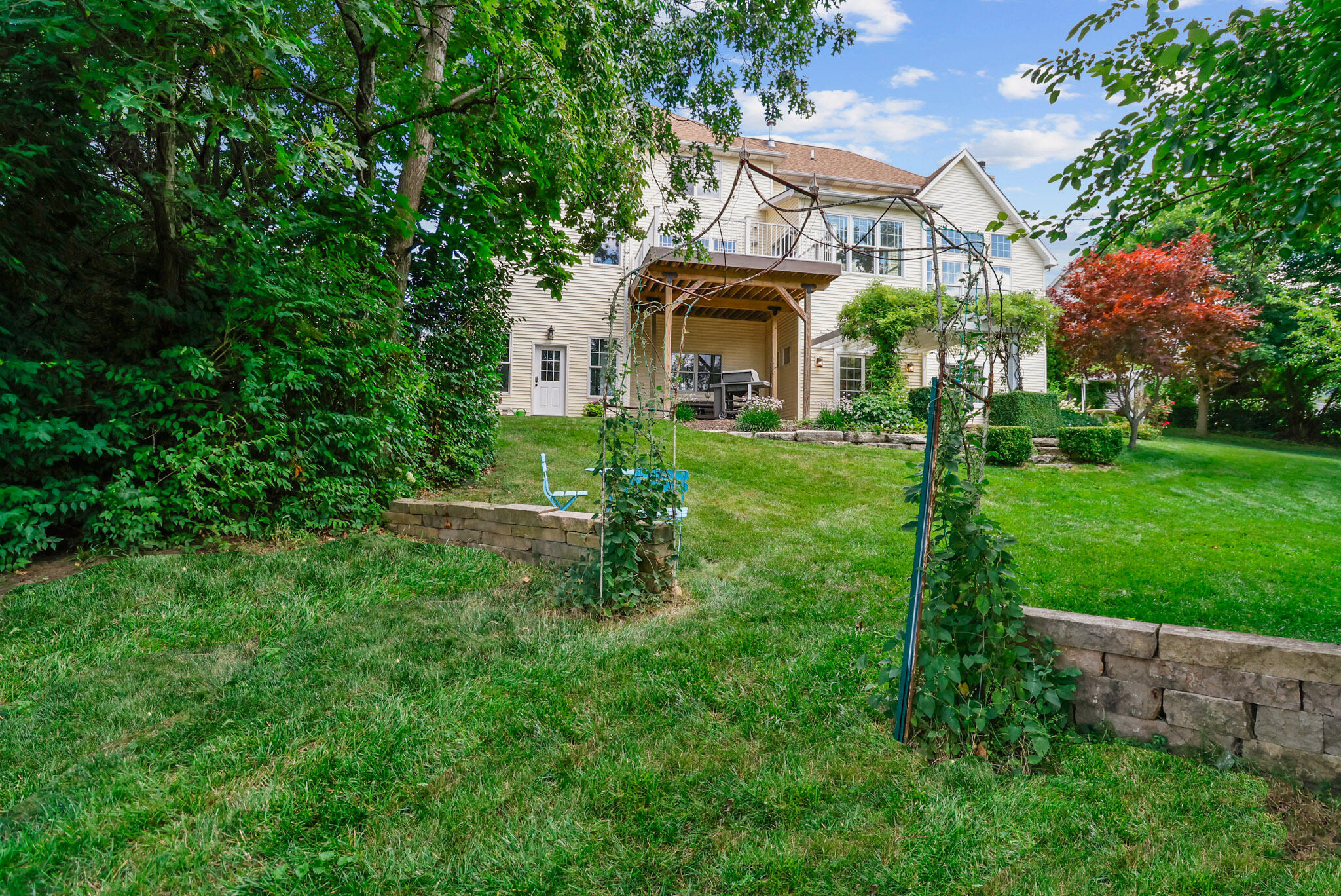709 Pennock Circle Crown Point, IN 46307 - Photo 61 of 67 a view of a big yard with plants and large trees