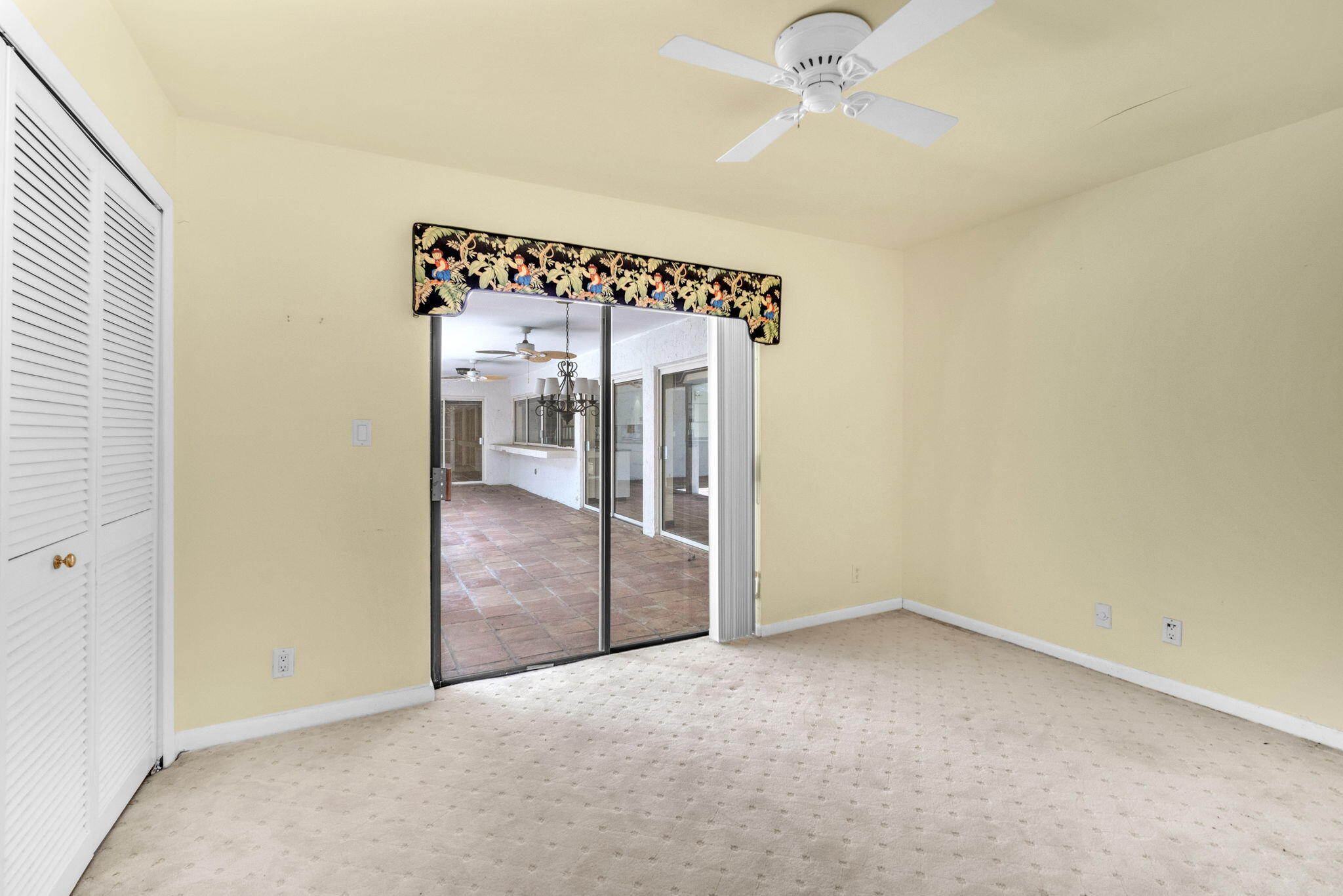 6794 Giralda Circle Boca Raton, FL 33433 - Photo 11 of 49 an empty room with a ceiling fan and a window